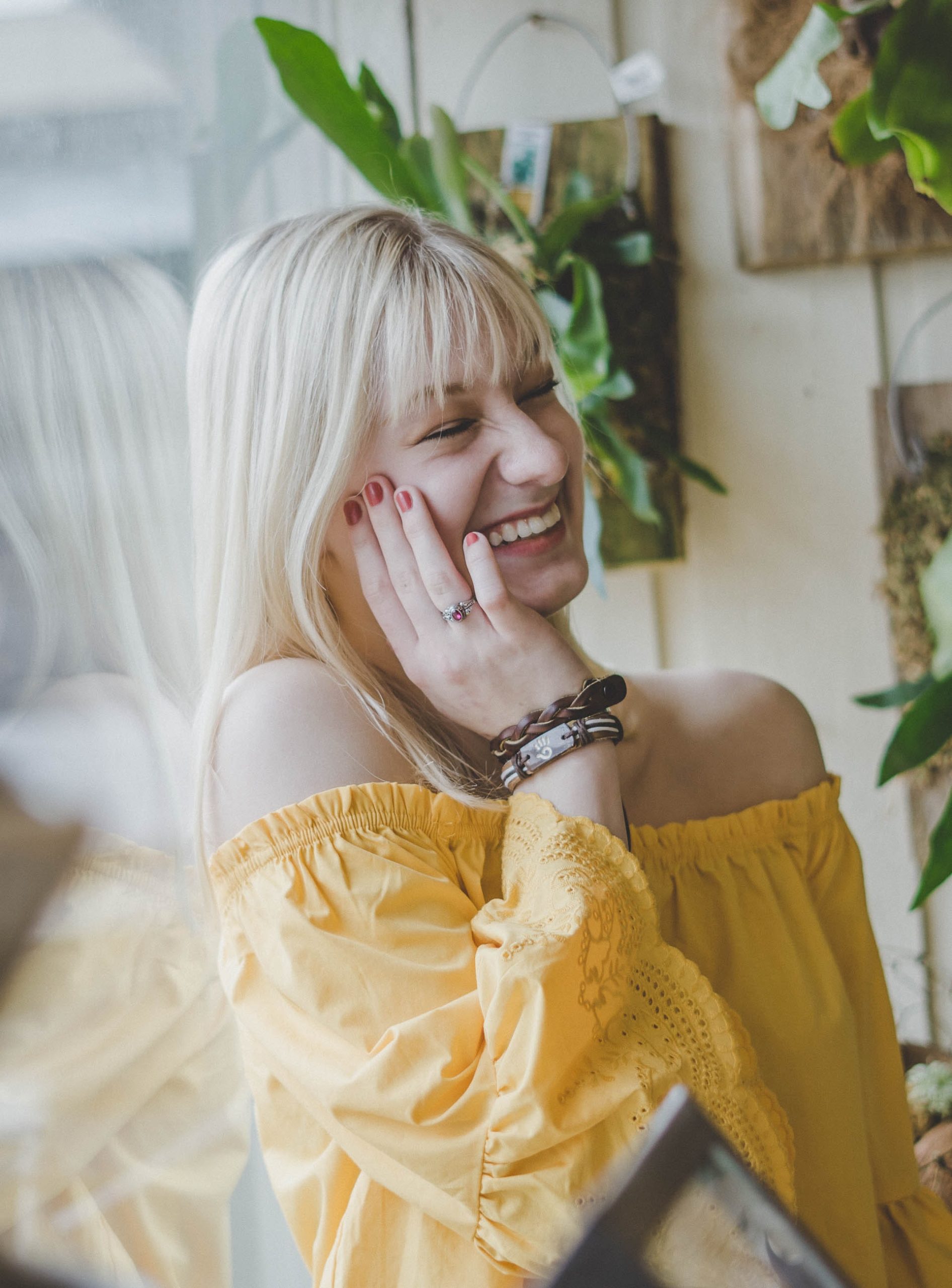 Women Smiling with lovely teeth including dental implants